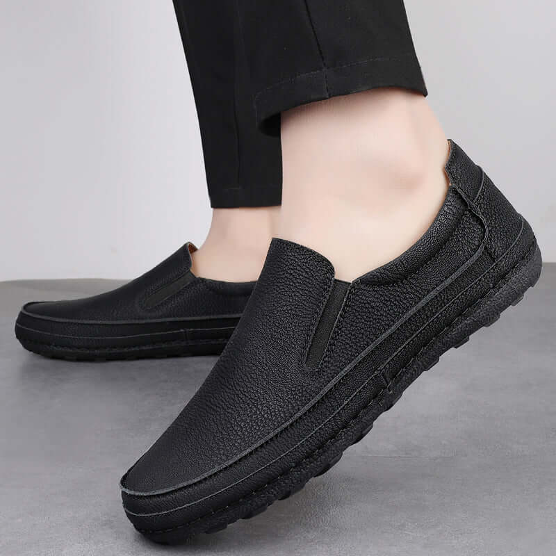 Alvero Genuine Leather Loafers in black, showcasing premium slip-on design for men seeking luxury and comfort with a formal style.