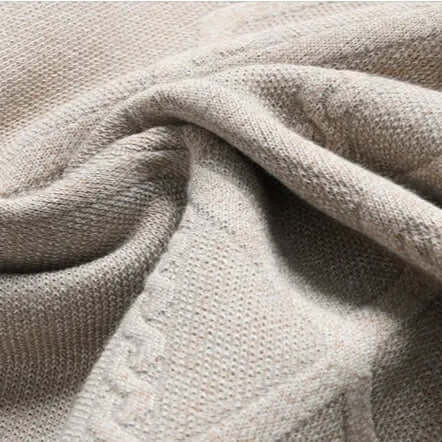 Close-up of Arezzo Sweater fabric showcasing geometric weave in a cotton-wool blend, ideal for men's winter knitwear and warm layering.