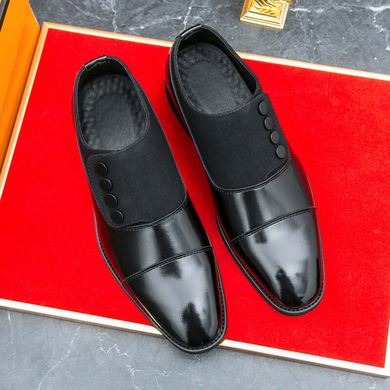 Giotto dual tone men's dress shoes with leather and suede finish on red surface.