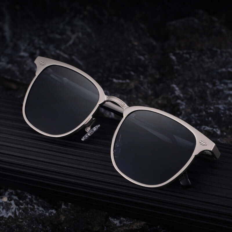 Polarised sunglasses for men by Sartori Shades with lightweight metal frame and UV400 lenses on dark background