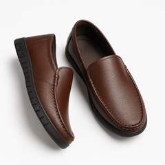 Elegant men's leather loafers in brown, showcasing refined slip-on design and premium craftsmanship.