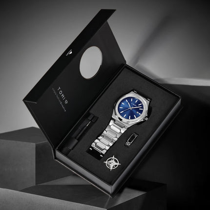 Northport Business Watch in gift box with stainless steel band and blue dial, showcasing minimalist design and complete calendar display.