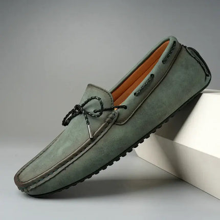 Elegant Ashford Leather Loafers in green suede, showcasing premium stitching and slip-on comfort for formal, stylish wear.