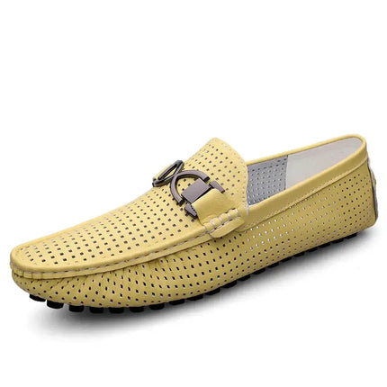 Perforated yellow slip-on leather loafer with decorative buckle, featuring a textured rubber sole for formal or casual men's wear.