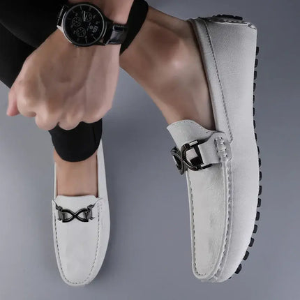 Menswear model showcasing elegant slip-on Benson Leather Loafers in premium white leather, offering superior comfort and formal style.