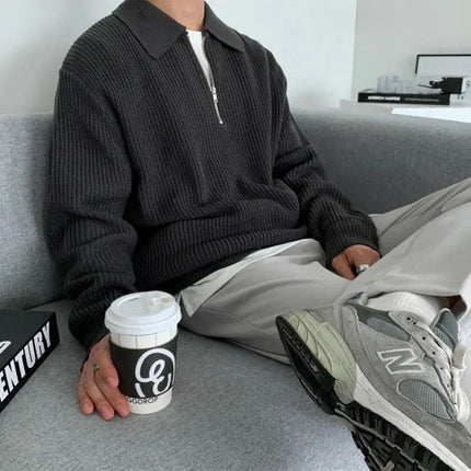 Man wearing Briar Quarter Zip Sweater, showcasing warm and stylish knitted sweater ideal for men's winter wear, exuding a cozy elegance.