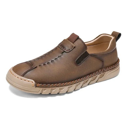 Catania Genuine Leather Loafers with hand-stitched detailing, elastic side panels, and rugged outsole. Elegant slip-on for formal men's style.