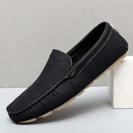 Giuliano Leather Loafers: Elegant men's slip-on leather shoes with perforated design, cushioned insole, and flexible build for formal style.
