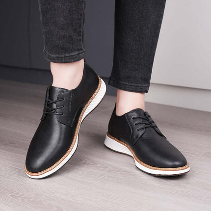 Person wearing Livorno Hybrid Shoes in black leather, showcasing slip-on design and cushioned footbed for comfort.