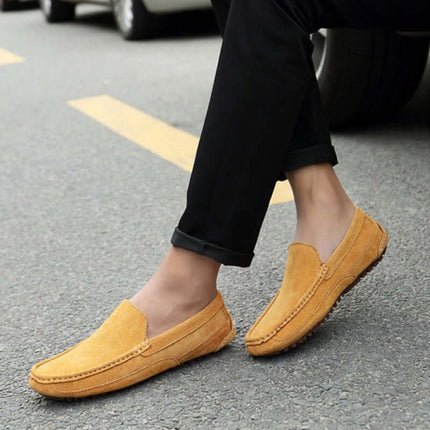 Lucera Slip-On Loafers in yellow suede on a city street, showcasing elegant minimalist design, perfect for formal and off-duty occasions.