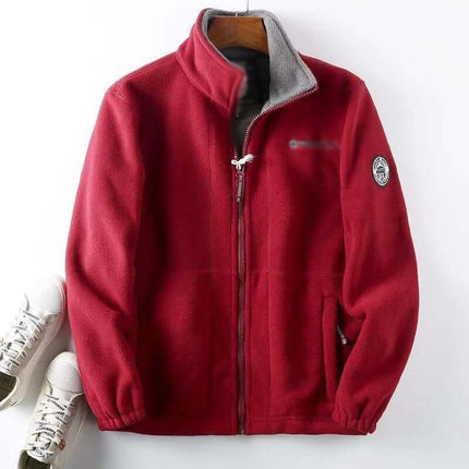 Men's hooded jacket with double-layer lining, red color, hanging on hanger, featuring zip front and logo patch, displayed with sneakers.