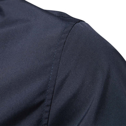 Close-up of Men’s Urban Style Jacket fabric in navy blue color, showcasing premium stitching details.