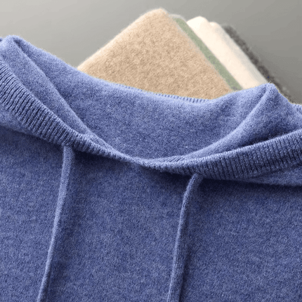 Monaco Hoodie in soft blue merino wool, showcasing luxurious comfort and winter warmth, ideal for layering and everyday wear.