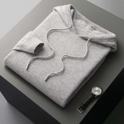 Monaco Hoodie folded on table, showcasing ultra-soft 100% merino wool with seamless construction, ideal for men's winter sweater and cozy layering.