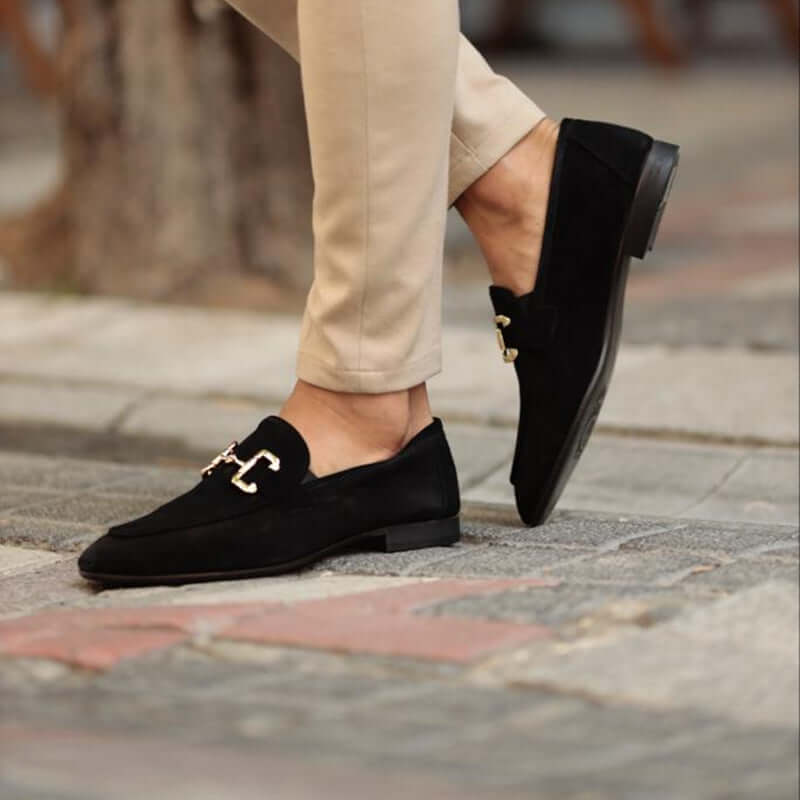 Montaro Suede Loafers in black suede with gold accent, classic slip-on design for men, showcasing elegance and luxury in formal style.