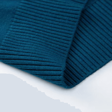 Close-up of Montclair Sweater's ribbed texture, showcasing the luxurious feel and classic turtleneck design for men's winter knitwear.
