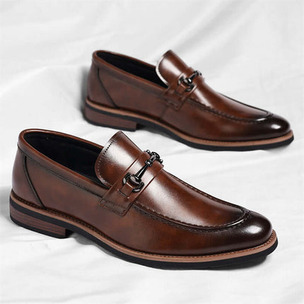 Montovani Leather Loafers with smooth leather, sleek pointed-toe, supportive footbed, stacked heel, and refined metal bit for luxurious formal style.