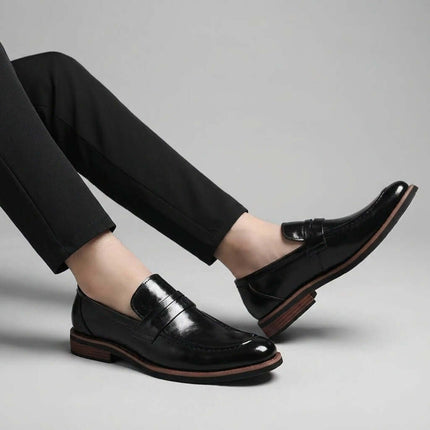 Montovani Leather Penny Loafers showcasing sleek silhouette with premium leather, slip-on comfort for formal and smart-casual style.