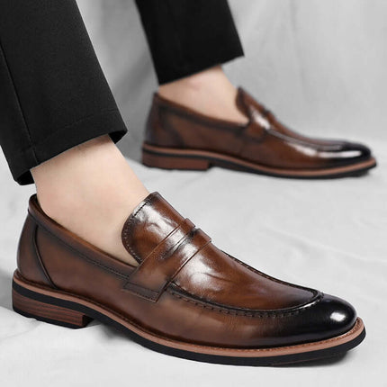 Montovani Leather Penny Loafers showcasing premium genuine leather with a sleek silhouette, perfect for formal and smart-casual men's fashion.