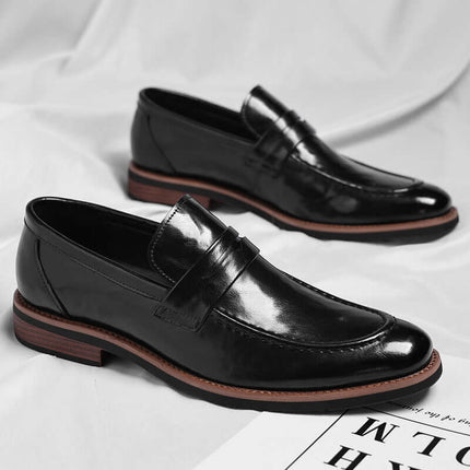 Montovani Leather Penny Loafers with sleek silhouette, showcasing premium black leather and polished finish. Ideal men's formal slip-on shoes.
