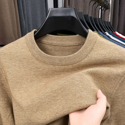 Orizio Knit Sweater displayed on a rack, showcasing its soft knit texture and warm beige colour, perfect for layering in men's winter fashion.