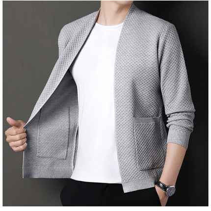 Man wearing Orvieto Cardigan, a warm wool-blend men's winter sweater, showcasing open front and geometric knit for stylish layering.