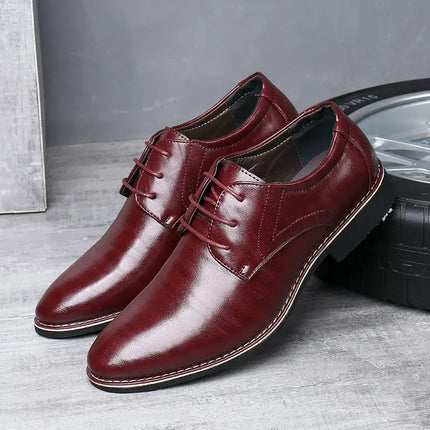 Roma Wingtip Dress Shoes in burgundy with brogue detailing and orthopedic sole on wooden floor