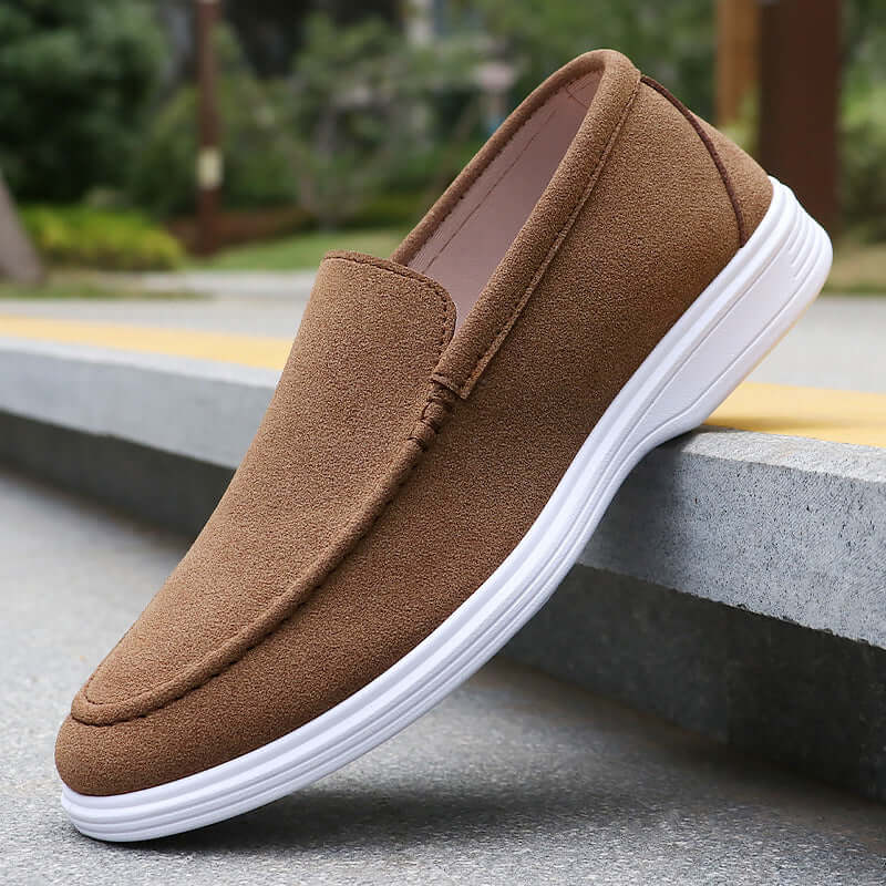 Elegant Salento Suede Loafers showcasing premium craftsmanship and slip-on comfort against an urban backdrop, ideal for formal settings.