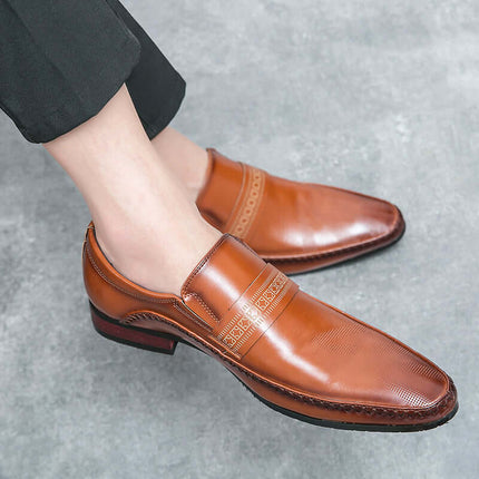 Silvano Leather Loafers in brown Italian leather with decorative strap, showcasing a formal and elegant design for men's slip-on style.
