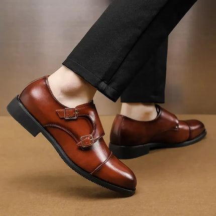 Person in black pants wearing Stratton Dress Shoes with double monk strap, showcasing polished genuine leather and modern design.