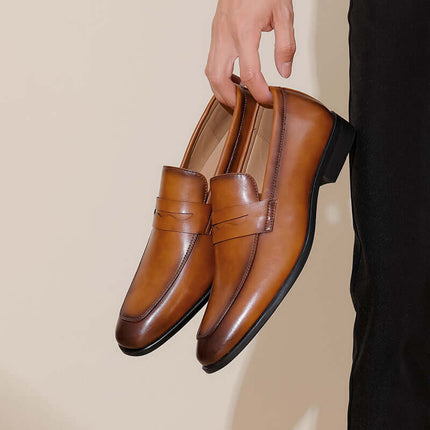Elegantly crafted Tuscano Leather Loafers, premium men's slip-on shoes offering luxurious comfort and formal style in genuine brown leather.