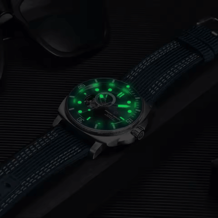 Valenor Automatic Diver Signature watch with glowing markers on black background