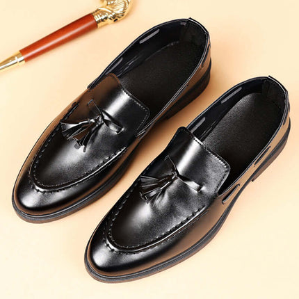 Valente Leather Tassel Loafers in black synthetic leather, showcasing classic tassel detailing and slip-on design for men's formal style.