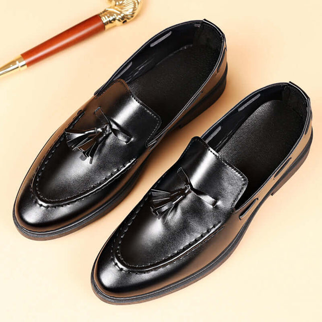 Valente Leather Tassel Loafers in black synthetic leather, showcasing classic tassel detailing and slip-on design for men's formal style.