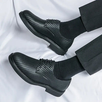 Black woven leather dress shoes with classic lace-up style and cushioned insole
