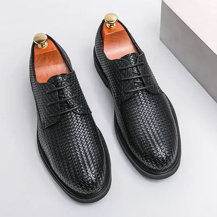 Black woven leather dress shoes with classic lace-up design, featuring orthopedic cushioned insole for stylish comfort.